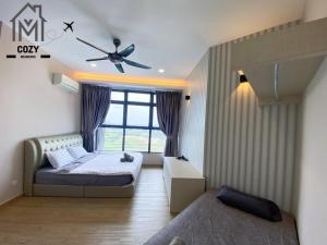 a bedroom with a bed and a window at Atlantis Premium 3BDR 4-12pax/5 min to jonker/town in Melaka