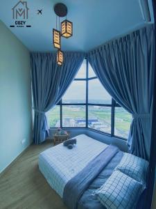 a bedroom with a bed and a large window at Atlantis Premium 3BDR 4-12pax/5 min to jonker/town in Malacca