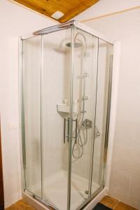 a glass shower stall with a sink in a bathroom at Casa Beta in Buenavista del Norte
