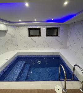 a swimming pool in a room with at Seven Beauties Hotel Spa Restaurant, Old City Baku in Baku