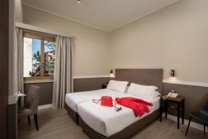 Postel nebo postele na pokoji v ubytování Fragrance Hotel St. Peter