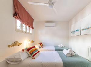 A bed or beds in a room at Ohliving La Judería