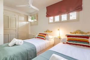 A bed or beds in a room at Ohliving La Judería