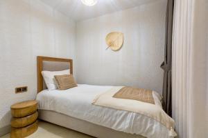 Кровать или кровати в номере Navalia Hotel