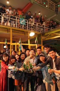 a group of people holding up their awards at Kunming Cloudland International Youth Hostel in Kunming