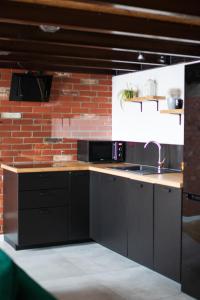 Kuchyňa alebo kuchynka v ubytovaní RedCity LOFT 303