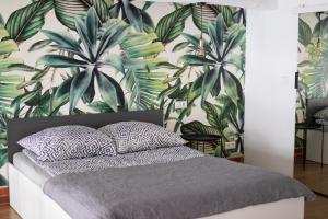 Posteľ alebo postele v izbe v ubytovaní RedCity LOFT 303