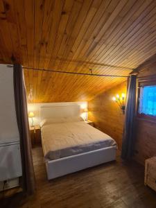 Una cama o camas en una habitación de Résidence Le fägot à Valmorel- studio 4 personnes