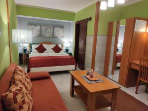Postel nebo postele na pokoji v ubytování Hotel Oswaldo