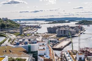 an aerial view of a river and a city at Spacious modern 2BR apartment at Central OSLO BARCODE in Oslo