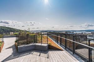 a balcony of a house with a view of the water at Luxurious 2BR apartment at Central OSLO BARCODE in Oslo