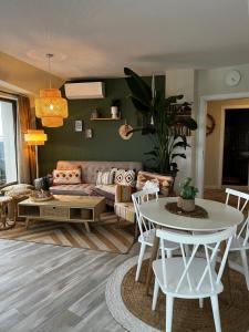 a living room with a couch and a table at Sky & Sea Apartment in Golden Sands