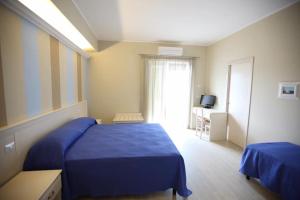Ένα ή περισσότερα κρεβάτια σε δωμάτιο στο Hotel Al Rustico