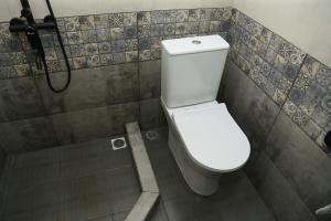 a bathroom with a toilet and a shower at Hotel MARUNA in Sevan