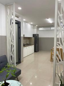 a large room with a kitchen and a living room at Home stay Hồ Thị Kỷ in Ho Chi Minh City