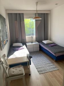 Postel nebo postele na pokoji v ubytování Housing Partners Viskari