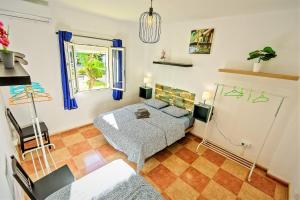 A bed or beds in a room at Plaza Polvorista 4-Bedroom Apartment w Balcony