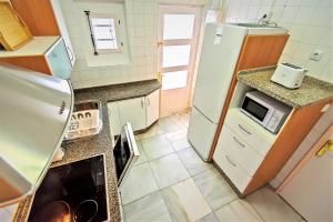 A kitchen or kitchenette at Plaza Polvorista 4-Bedroom Apartment w Balcony