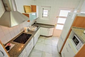 A kitchen or kitchenette at Plaza Polvorista 4-Bedroom Apartment w Balcony