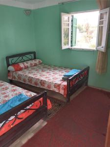 Postel nebo postele na pokoji v ubytování Rose house