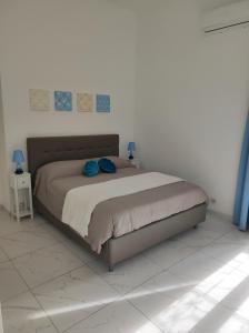 Ένα ή περισσότερα κρεβάτια σε δωμάτιο στο Casa della Sibilla