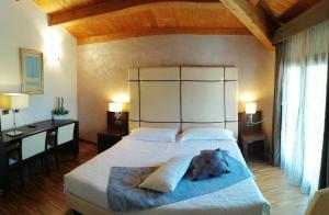 Postel nebo postele na pokoji v ubytování Albergo Minuetto + 33 fotografií