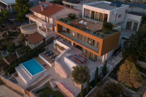 an overhead view of a house with a swimming pool at Villa Gloss Primosten in Primošten