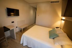 Posteľ alebo postele v izbe v ubytovaní Hotel Diufain
