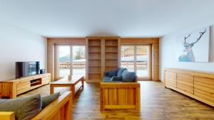 TV a/nebo společenská místnost v ubytování Les Mayens LUXURY & COSY apartments