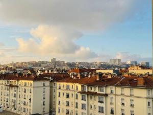 a view of a building with a city in the background at Central, confort, 2 chambres, parking - Lyon 6e in Lyon