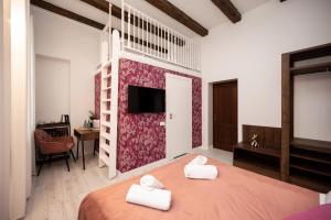 Posteľ alebo postele v izbe v ubytovaní Hive Family House