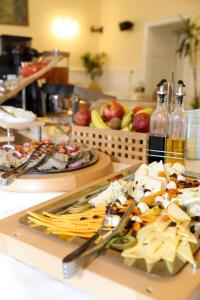 two plates of food on a table with appetizers at Palatul Brukenthal Avrig in Avrig