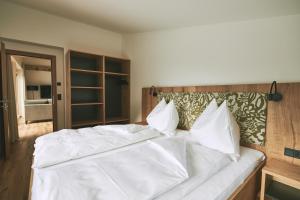 A bed or beds in a room at Brandnerhof