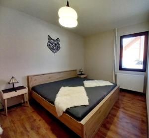 A bed or beds in a room at Vila Devana