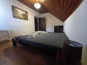 A bed or beds in a room at Vila Devana