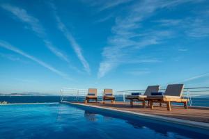 The swimming pool at or close to Iris Villas Lefkada - Karavi Villa with private sea access
