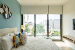 Postel nebo postele na pokoji v ubytování The City Playa + 56 fotografií