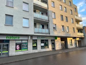 a building on the side of a street at DMK Green Apartment near Warsaw-Modlin Airport in Nowy Dwór Mazowiecki