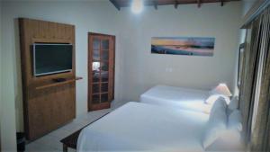 Cama ou camas em um quarto em Hiu Hotel