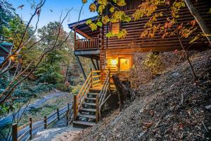 a staircase leading up to a log cabin at Sugar Bear Cabin in Sevierville