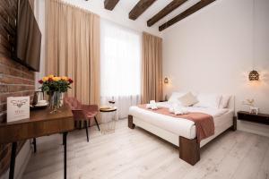 Posteľ alebo postele v izbe v ubytovaní Hive Family House