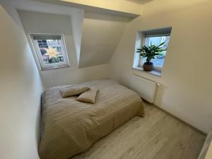 Rúm í herbergi á Apartamenty Wisła Centrum