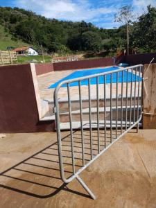 a metal railing in front of a skateboard ramp at Casa - Sítio da Tabi - Lagoinha-SP in Lagoinha