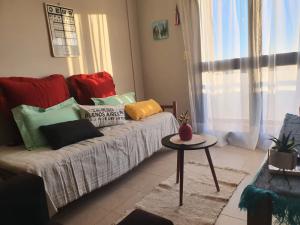 a living room with a couch and a table at Marfil in Posadas