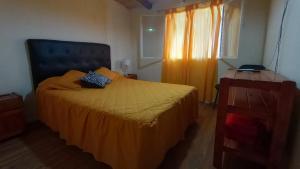 Una cama o camas en una habitación de Lomas del Uritorco - Casa de Alq x Temp