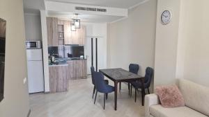 a kitchen and dining room with a table and chairs at Uparthotel in Tsaghkadzor