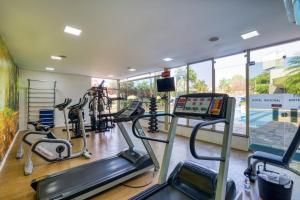 a gym with treadmills and ellipticals in a room at Hotel Nacional de Rio Preto - Distributed by Intercity in Sao Jose do Rio Preto