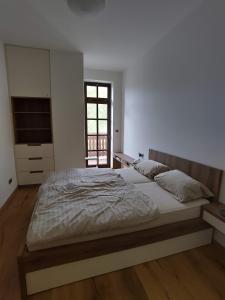 Postel nebo postele na pokoji v ubytování Apartmán Strunzova pila Kvilda 203