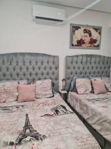 Giường trong phòng chung tại Hermoso Pent House en Armando's Le Club Se Renta +9 ảnh