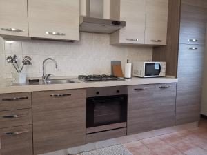 A kitchen or kitchenette at AT HOME IN CREMONA